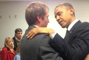 President Obama consoles Robert Parker, father of victim Emilie Parker. 