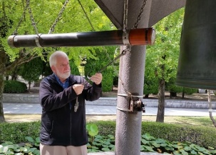 Sam is privileged to rink the Peace Bell in Hiroshima's Peace Park. 