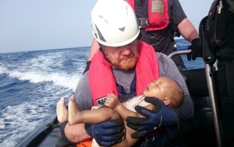 ATTENTION EDITORS - VISUAL COVERAGE OF SCENES OF INJURY OR DEATHA German rescuer from the humanitarian organisation Sea-Watch holds a drowned migrant baby, off the Libyan cost May 27, 2016. The baby, who appears to be no more than a year old, was pulled from the sea after a wooden boat capsized last Friday. Mandatory Credit Christian Buettner/Eikon Nord GmbH Germany/Handout via REUTERS ATTENTION EDITORS - THIS IMAGE WAS PROVIDED BY A THIRD PARTY. FOR EDITORIAL USE ONLY. NO RESALES. NO ARCHIVES. MANDATORY CREDIT. TEMPLATE OUT.